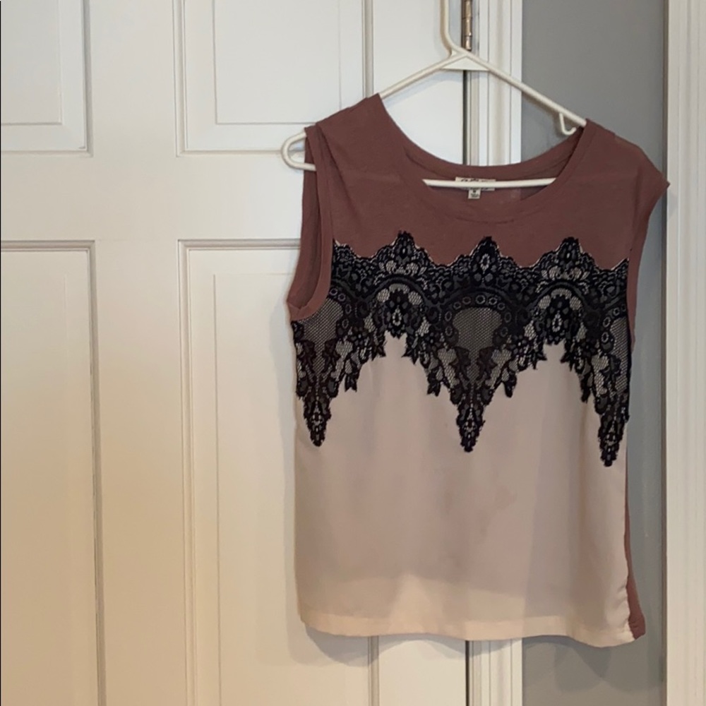 ezra sleeveless tan, brown and black tee shirt.
